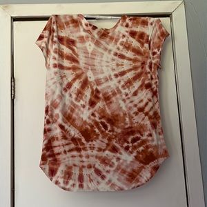 Cupio Tie Die Shirt With the Colors Orange, Red, and White.